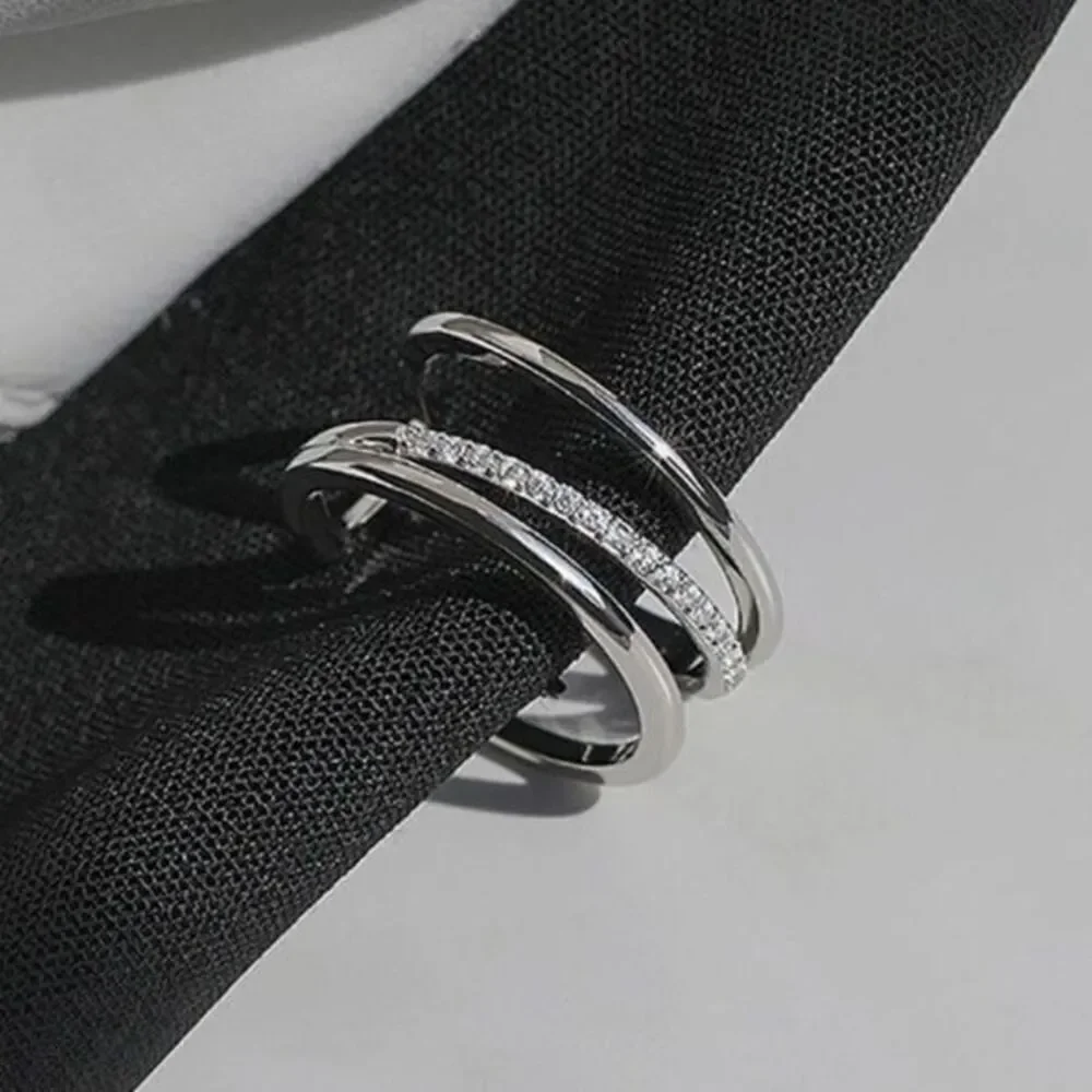 - The Triple Bling Ring adjustable in  925 silver & cubic zirconia